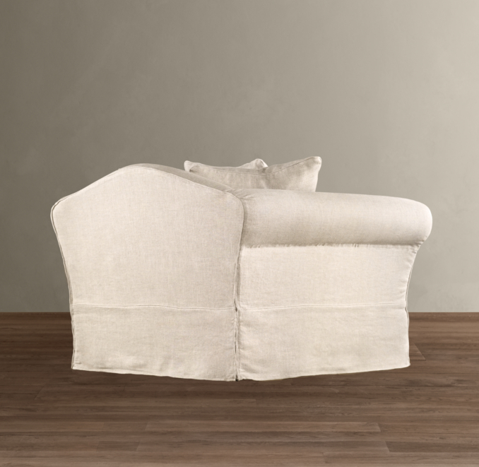 Camelback Slipcovered Swivel Chair