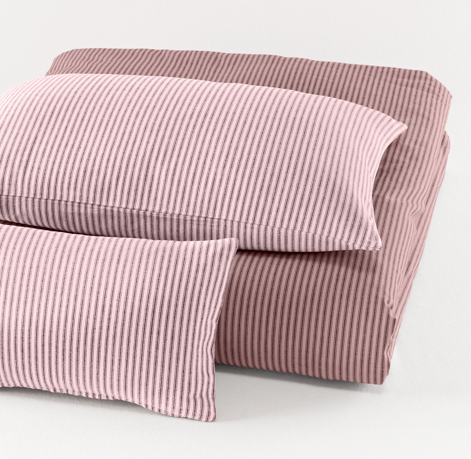 Duvet cover shown in dusty rose and shams shown in petal.