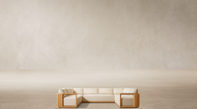 Shown in Natural Teak. Cushions shown in Sand Outdoor Performance Bouclé; sectional consists of 1 three-seat left-arm return sofa, 1 two-seat armless sofa and 1 three-seat right-arm return sofa.
