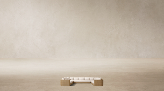 Shown in Natural. Cushions shown in Natural Perennials® Performance Linen Weave; sectional consists of 1 four-seat left-arm return sofa, 1 three-seat armless sofa and 1 four-seat right-arm return sofa.