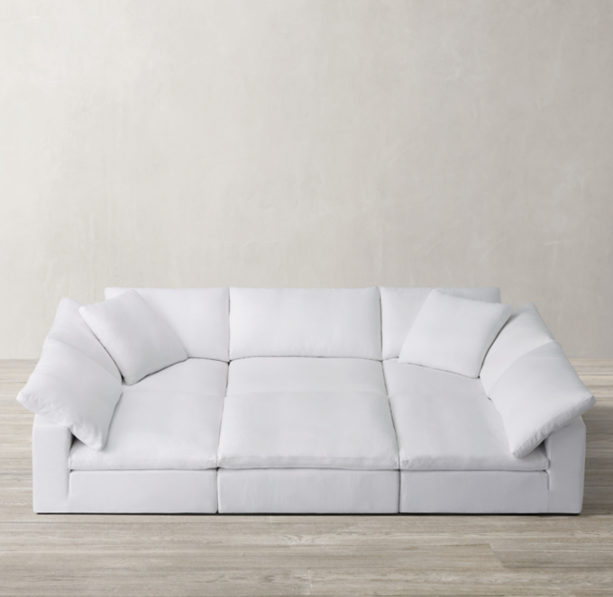 Shown in White Washed Belgian Flax Linen; sectional consists of 2 corner chairs, 3 armless chairs and 1 end-of-sectional ottoman.