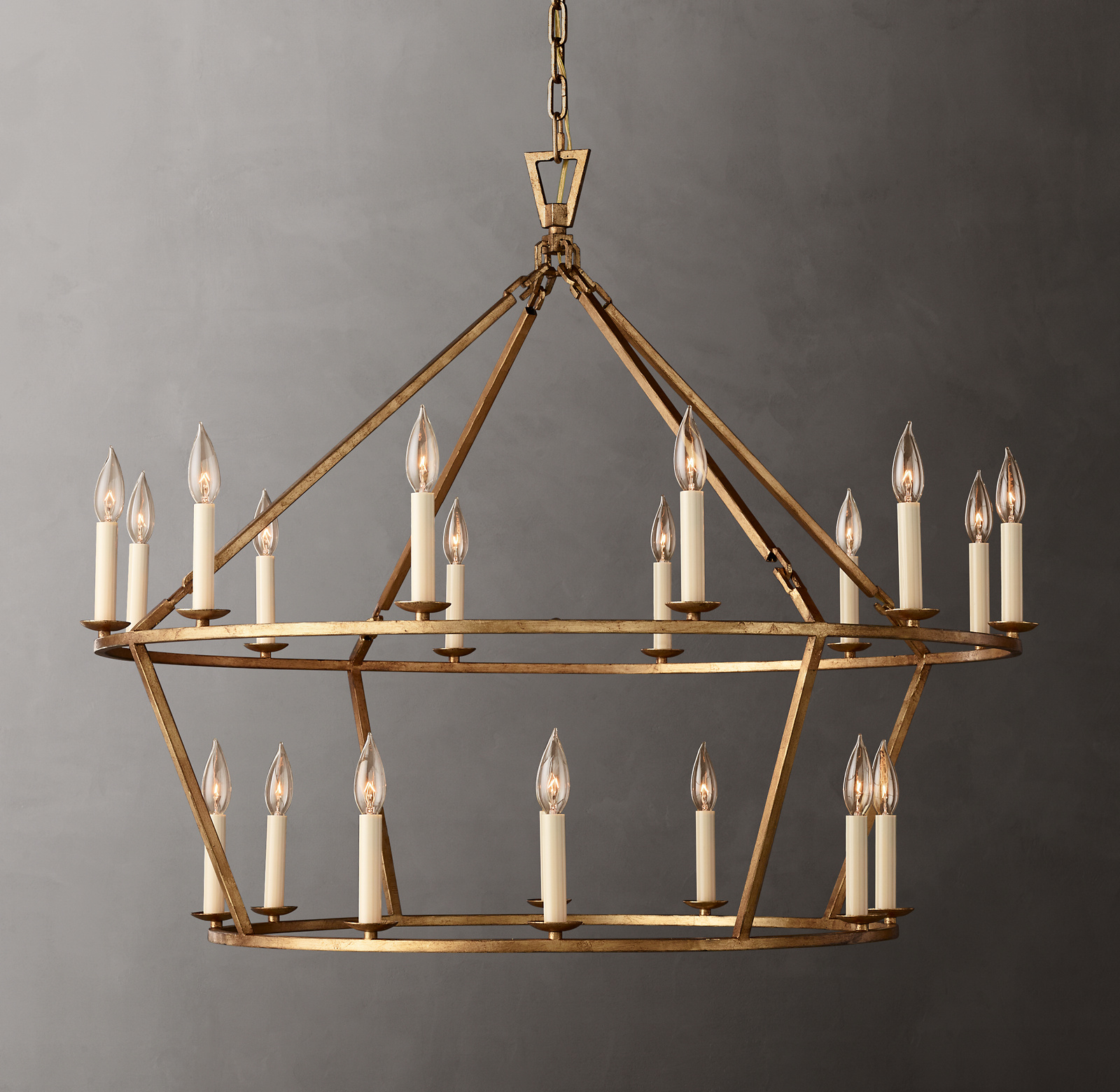 Shown in Gilded Iron with ivory candle sleeves (included).