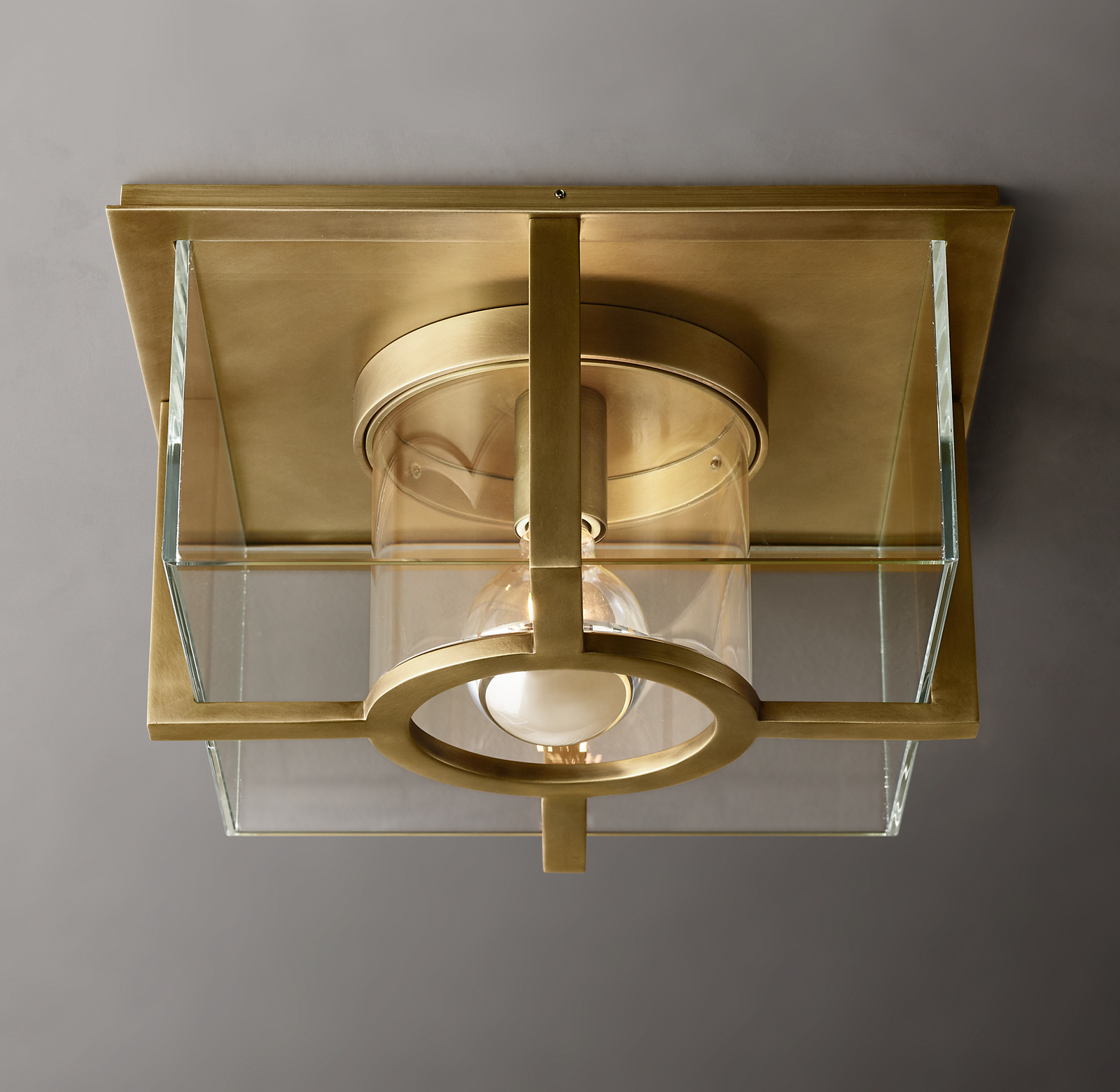 Shown in Lacquered Burnished Brass with clear glass shade.