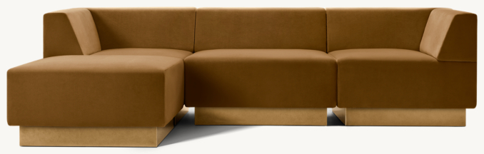 Shown in Burnt Caramel Performance Velvet with Brass finish; sectional consists of 1 left-arm chair, 2 armless chairs, 1 right-arm chair and 1 ottoman.