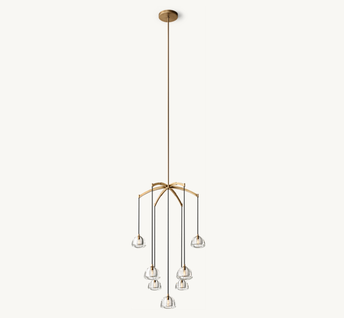 Long chandelier shown in Natural Brass.