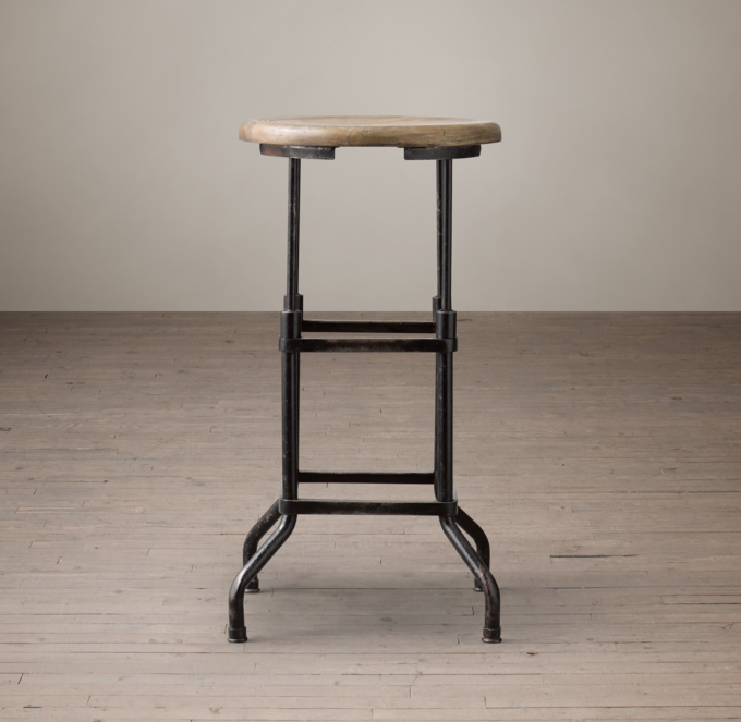fully adjustable early 1920's american vintage industrial four-legged  factory workbench stool with pre-drilled hole extensions