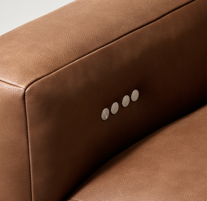 Motion control buttons located on inside arm of arm chairs.