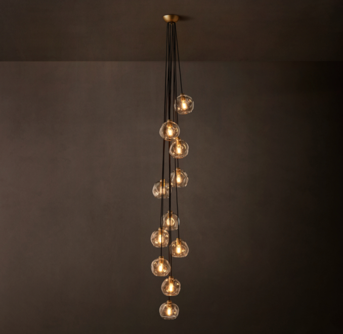 11-globe pendant shown in Lacquered Burnished Brass.