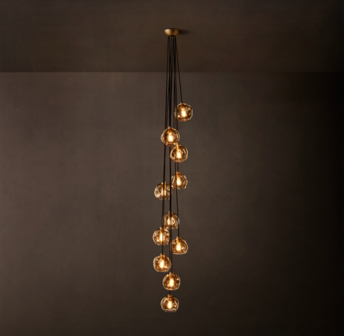 11-globe pendant shown in Lacquered Burnished Brass.