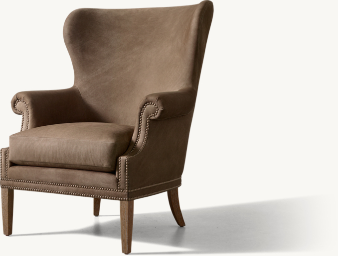 Ashford - Poltrona in pelle con schienale a orecchie e borchie