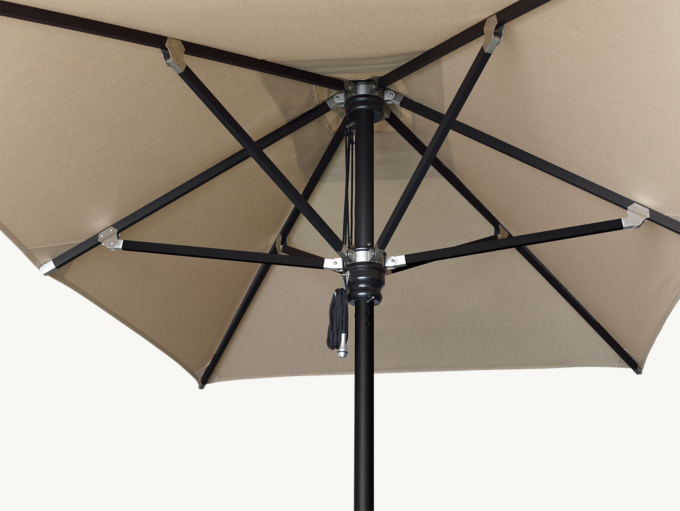 Detail view of Rh Premium Rectangular Aluminum Umbrella shown in Black With Natural Sunbrella Canvas.