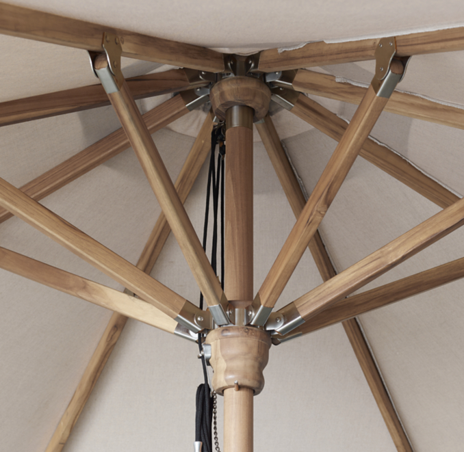 Detail view of Rh Premium Octagonal Teak Umbrella shown in Natural Teak&Natural Sunbrella Canvas.