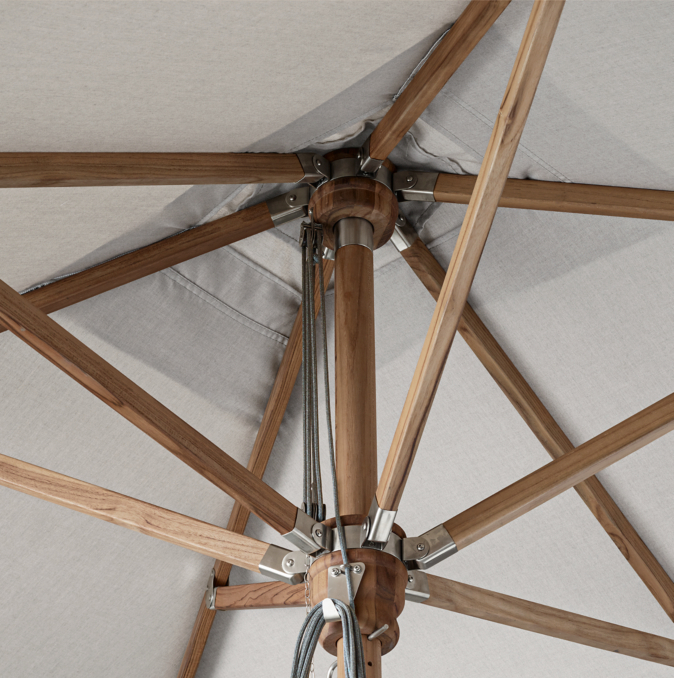 Detail view of Rh Premium Rectangular Teak Umbrella shown in Teak With Natural Sunbrella Canvas.