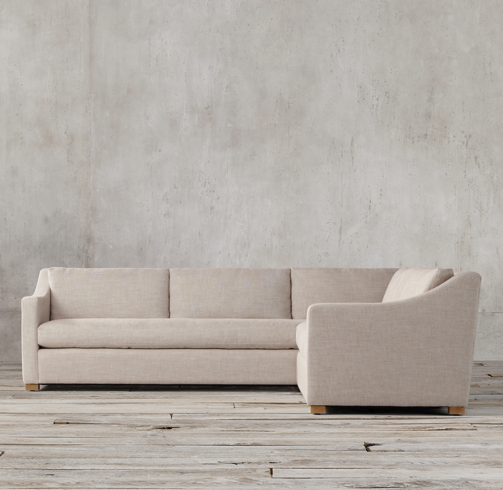 Shown in Sand Belgian Linen; sectional consists of 1 left-arm return sofa and 1 right-arm sofa.