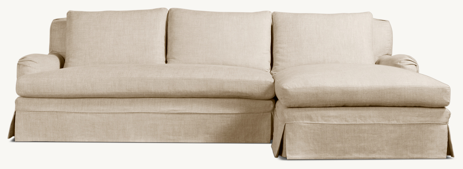 Shown in Sand Belgian Linen; sectional consists of 1 left-arm sofa and 1 right-arm chaise. Cushion configuration may vary by component.