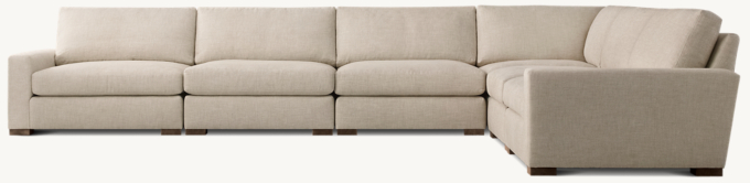 Shown in Sand Classic Belgian Linen; sectional consists of 1 left-arm chair, 1 corner chair, 1 right-arm chair and 3 armless chairs. Cushion configuration may vary by component. 