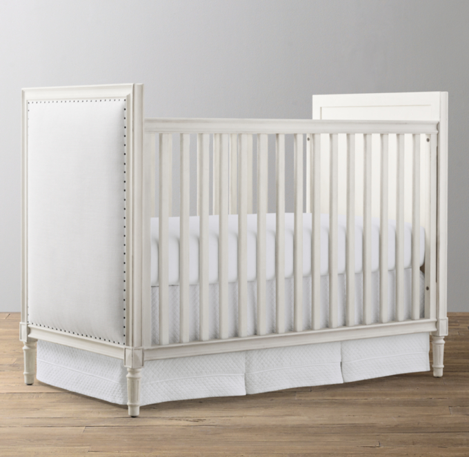 White store upholstered crib