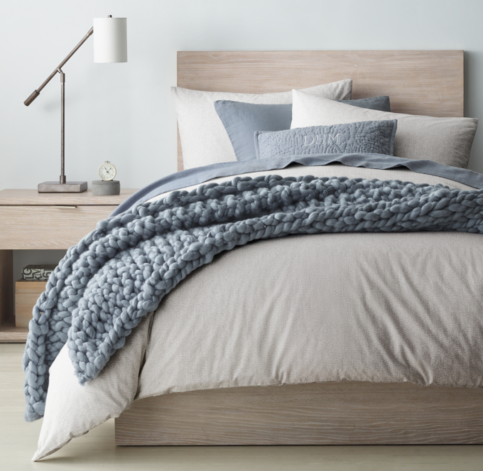 Duvet cover and sham shown in Grey. Sheet set, quilted sham and bed throw shown in Ocean.