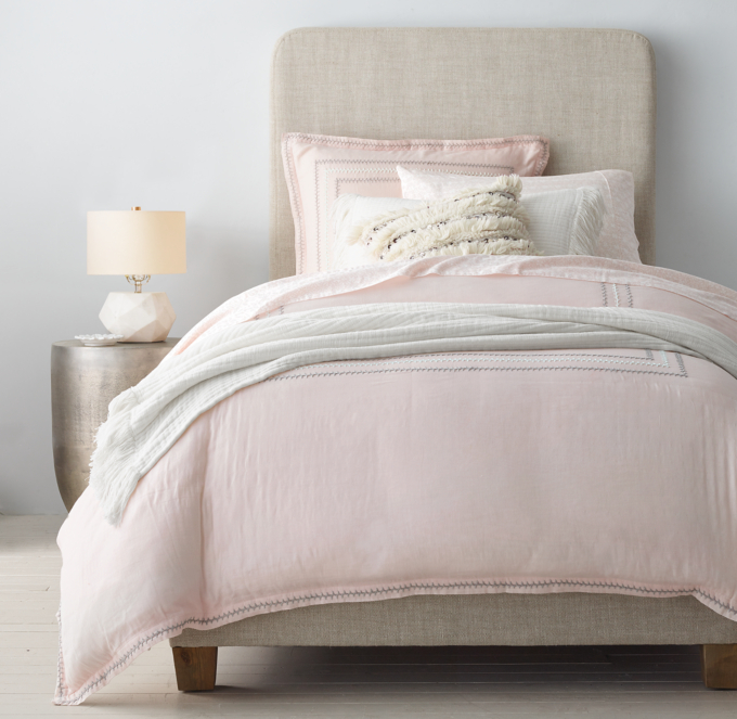 Duvet cover, sham, sheet set, quilt and quilted sham shown in Blush. Decorative pillow shown in Natural Fringe Stripe. 