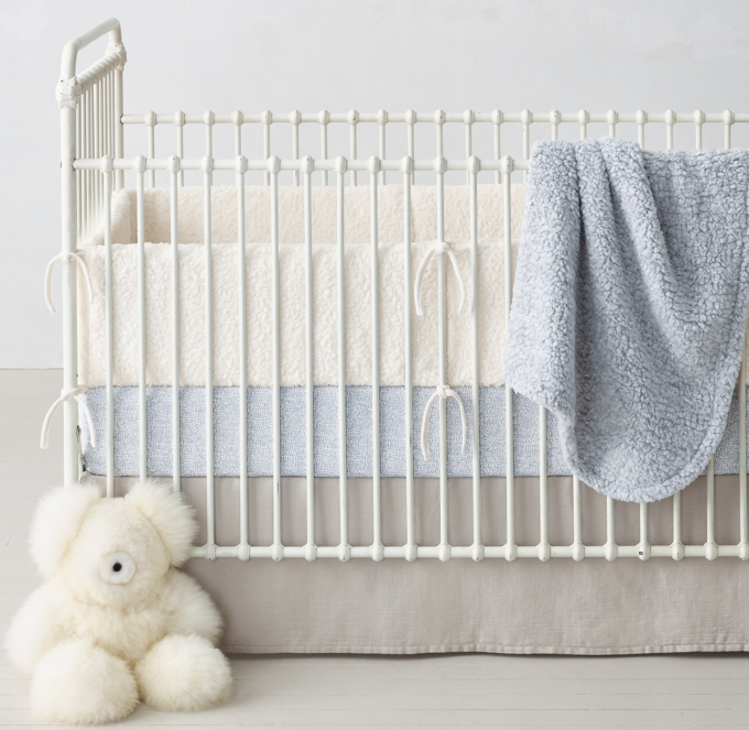 Shown in ivory. Featured with Obscura Dot Crib Fitted Sheet in ocean, Heathered Sherpa Hooded Stroller Blanket in ocean and Washed Cotton Gauze Crib Skirt in ash.