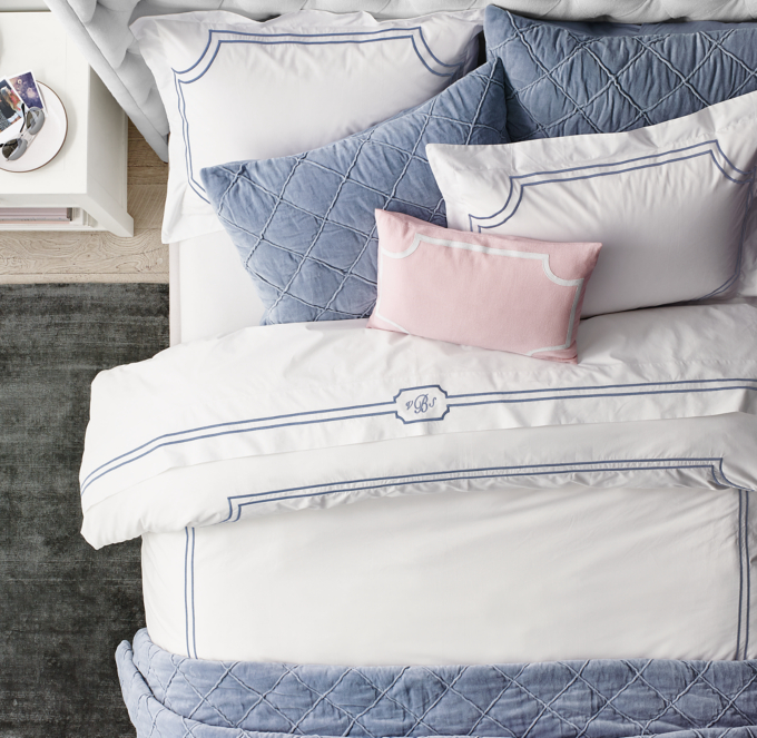 Shown in French Blue. Featured with Framed Satin Stitch Sheet Set in French Blue, Hand-Stitched Washed Velvet Quilt and Shams in French Blue and Appliqu&#233;d Framed Pillow Cover in Dusty Rose.