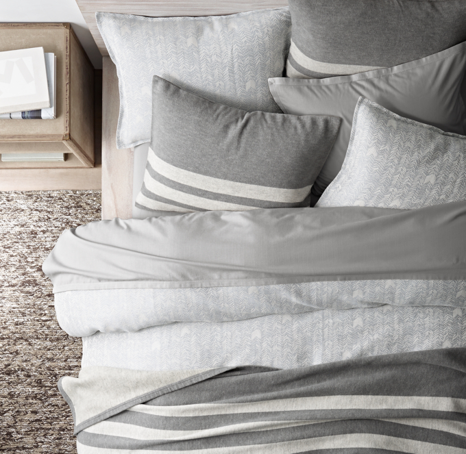 Duvet cover and shams shown in Storm. Sheet set, blanket and shams shown in Grey.