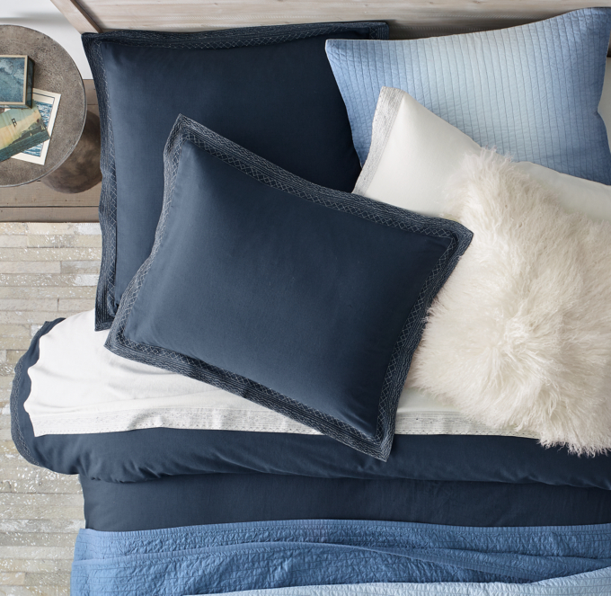 Duvet cover and sham shown in Indigo. Sheet set shown in White. Quilt and quilted sham shown in Ocean. Pillow cover shown in Natural White.