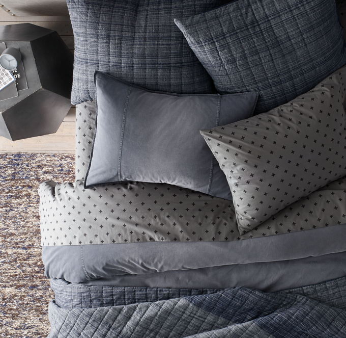 Duvet cover and sham shown in Blue. Sheet set shown in Black/Grey. Quilt and quilted shams shown in Indigo.