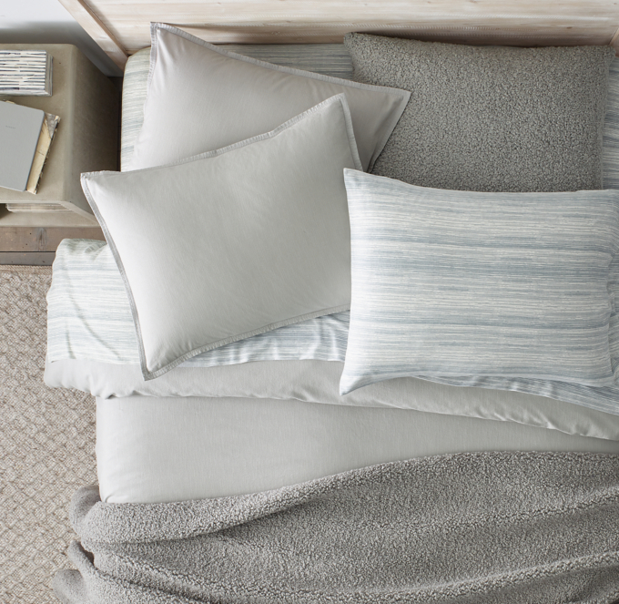 Duvet cover, sham, bed throw and decorative pillow cover shown in Grey. Sheet set shown in Ocean.