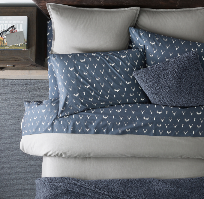 Duvet cover and shams shown in Grey. Sheet set, bed throw and decorative pillow cover shown in Navy.