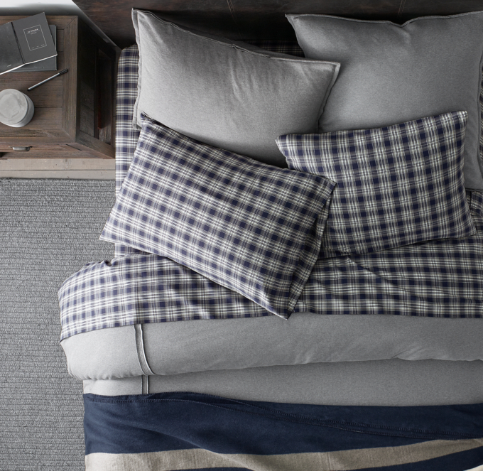 Duvet cover and shams shown in Grey. Sheet set and blanket shown in Navy.