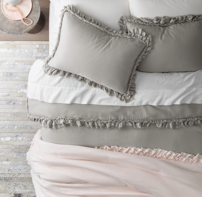 Duvet cover and shams shown in Ash. Sheet set shown in White. Quilt shown in Posy.