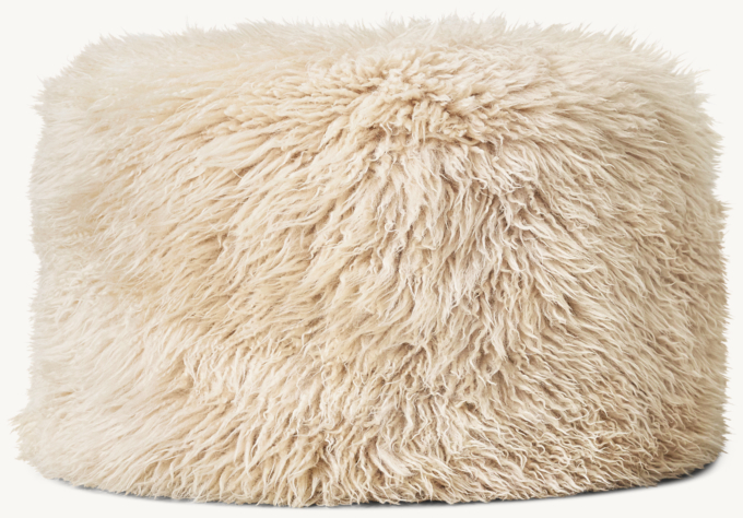 Three Quarter view of New Zealand Sheepskin Round Pouf - Ivory 